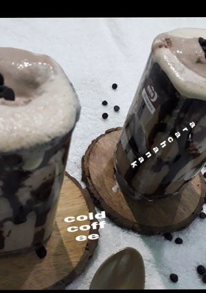 A picture of Cold coffee with icecream choco chips.