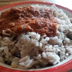 A picture of White rice,bean and Stew.