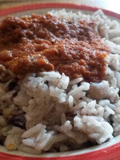 A picture of White rice,bean and Stew.