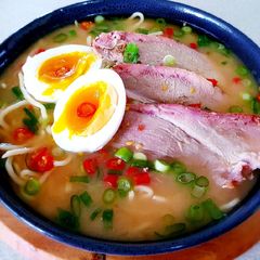 A picture of Pork Ramen Noodles with Miso Soup.