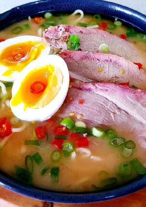 A picture of Pork Ramen Noodles with Miso Soup.