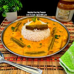 Drumstick Potato Yogurt Curry - Sahjan Aloo Besan Kadhi - Saragva Bateta Nu Khatiyo Shaak A picture of Drumstick Potato Yogurt Curry - Sahjan Aloo Besan Kadhi - Saragva Bateta Nu Khatiyo Shaak.
