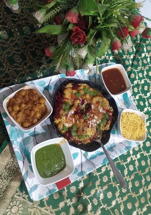 A picture of Chole ragda with potato pattice.