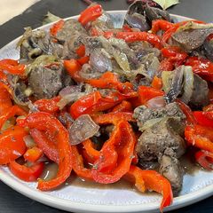 A picture of Goose Liver with Onions and Bell Peppers.