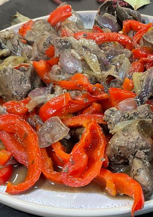 A picture of Goose Liver with Onions and Bell Peppers.