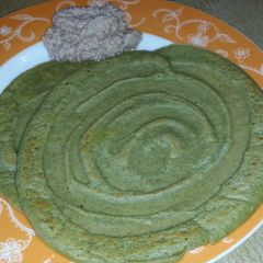 A picture of Pesarattu (green gram dosa) with onion chutney.