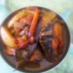A picture of Fish curry with vegetables.