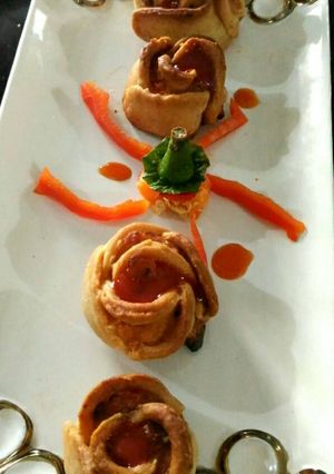 A picture of Rose shape bake cheesey snacks.