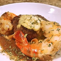 Filet with Giant Prawn, Pan Sauce and Béarnaise Compound Butter A picture of Filet with Giant Prawn, Pan Sauce and Béarnaise Compound Butter.