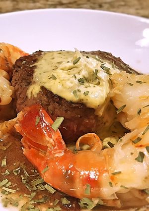 A picture of Filet with Giant Prawn, Pan Sauce and Béarnaise Compound Butter.