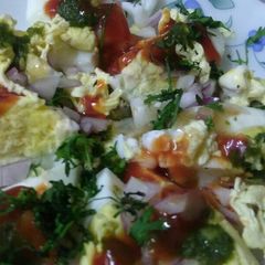 A picture of Boiled eggs with scumble eggs with all Masala.