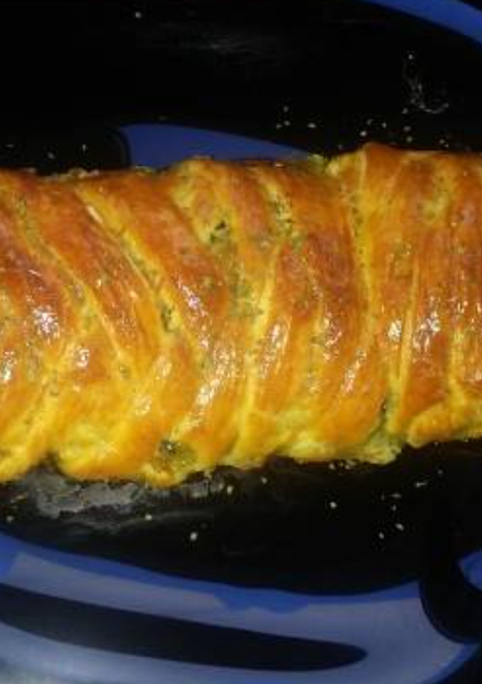 Una foto de Trenza de hojaldre con espinacas