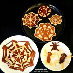 A picture of Halloween Spiders And Chocolate Vanilla Eggless Spiderweb Pancake.