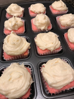 A picture of Strawberry Yogurt Cupcakes with cream cheese frosting.