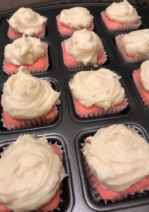 A picture of Strawberry Yogurt Cupcakes with cream cheese frosting.