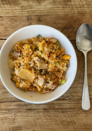 A picture of Fried rice with Korean Kimchi and pork belly.