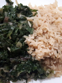 A picture of Rice served with spinach.