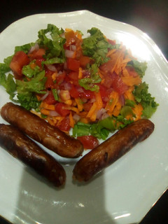 A picture of Salad and sausage.