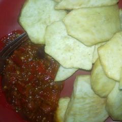 A picture of Fried sweet potato with red chilli sauce.