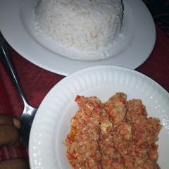 A picture of White Rice with Corned beef and Egg Sauce.