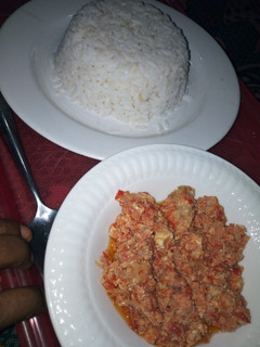A picture of White Rice with Corned beef and Egg Sauce.