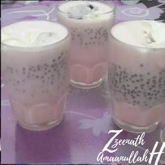 A picture of Roohafza Lassi with Basil Seeds.