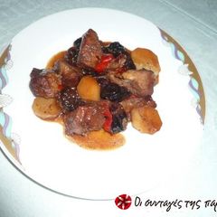 A picture of Pork with plums.