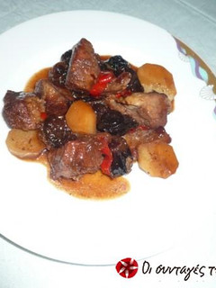 A picture of Pork with plums.
