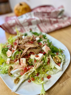 Foto principal de Ensalada de escarola con granada y melva de canutera
