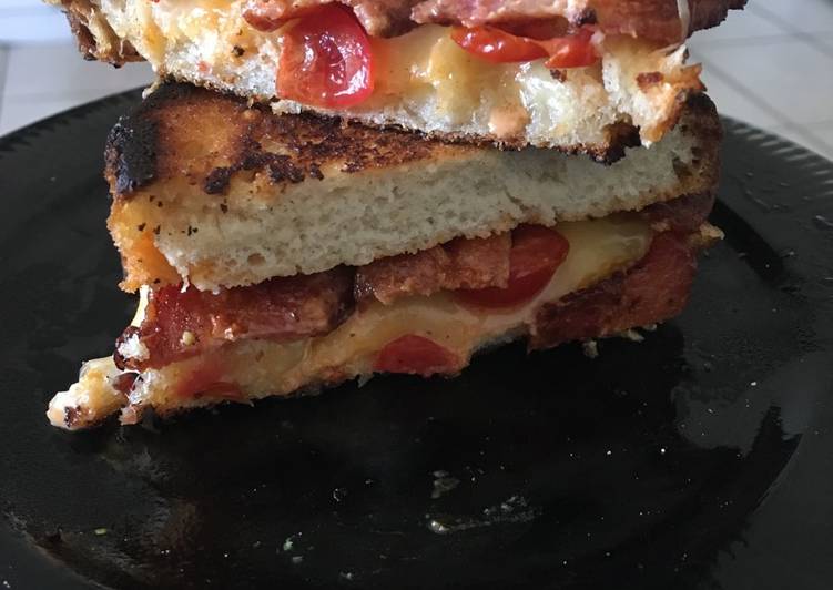 Luxe grilled cheese with tomatoes and bacon on Sourdough