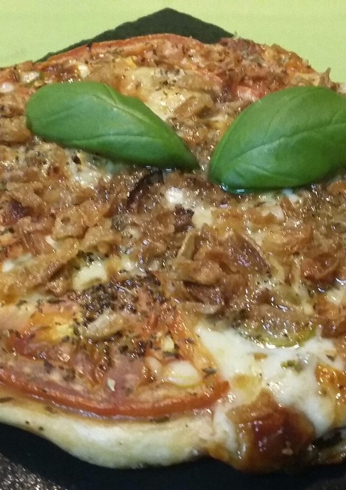 Una foto de Pizza individual de hojaldre