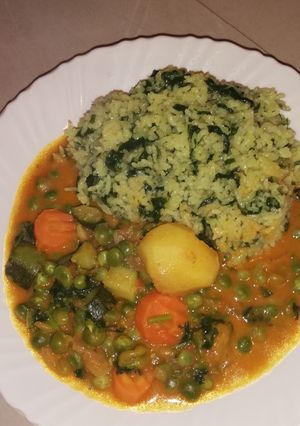 A picture of Spinach rice and vegetable curry.
