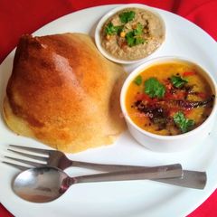 A picture of Dosa, Sambhar, Chutney.