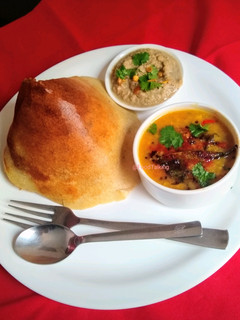 A picture of Dosa, Sambhar, Chutney.