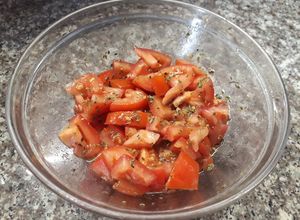 Una foto de Tomates condimentados