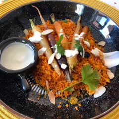 A picture of Roasted carrots with harissa couscous.