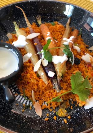 A picture of Roasted carrots with harissa couscous.