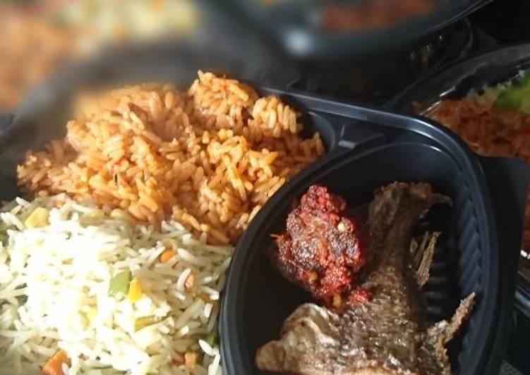 Fried and jollof rice with fried fish and meat