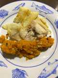 Brótola en salsa de naranja co puré de calabaza con piñones