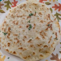 A picture of Cheesy garlic naan.