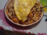 Rice and beans served with filed egg