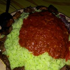 A picture of Color rice and stew with tsirai.