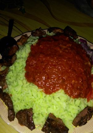 A picture of Color rice and stew with tsirai.