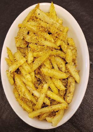 Una foto de Papas fritas crocantes rebozadas con polenta