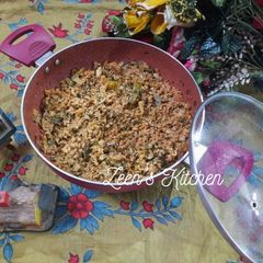 A picture of Keema Ambada or Lamb Mince with Red Sorrel Leaves.