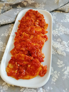 Una foto de Pollo con tomate