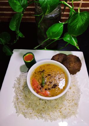 A picture of Dhabba Style Moong Masoor Tarka Daal With White Rice 🍚😋.