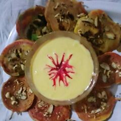 A picture of Sweet dryfruits mini besan uttapa colourful.