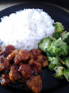 A picture of Asian Style Orange Chicken with Spicy Sauteed Brocoli.
