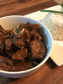 A picture of Caribbean curry goat and Rice.